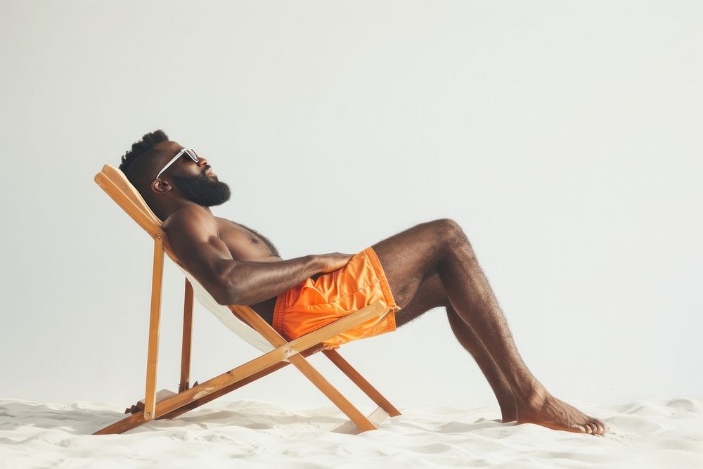 Photo of black man lay on beach chair sunbathing sitting travel.