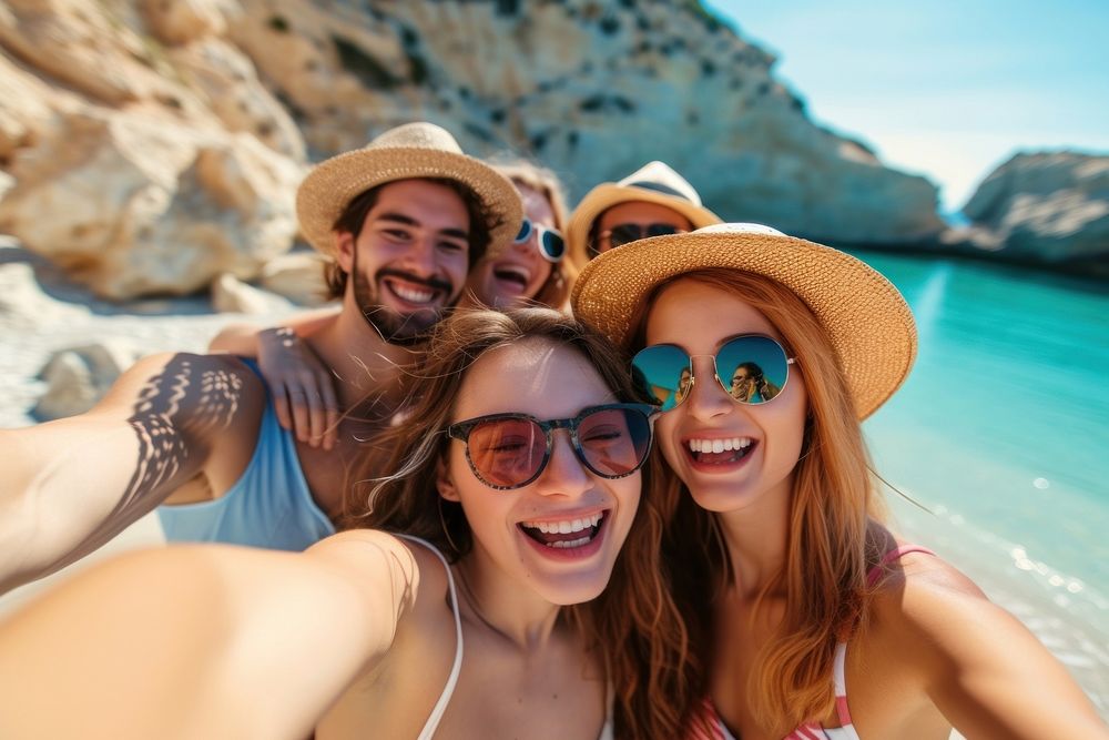 Group of friends taking selfie on sunny beach glasses adult photographing.