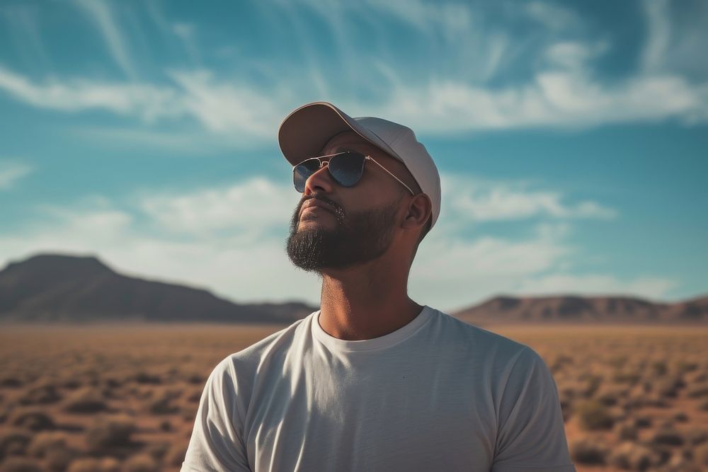 Indian american man sunglasses portrait outdoors.