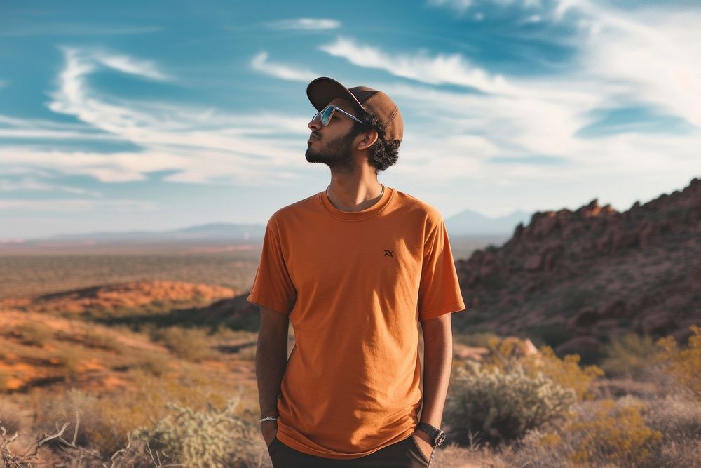Indian american man t-shirt outdoors desert.