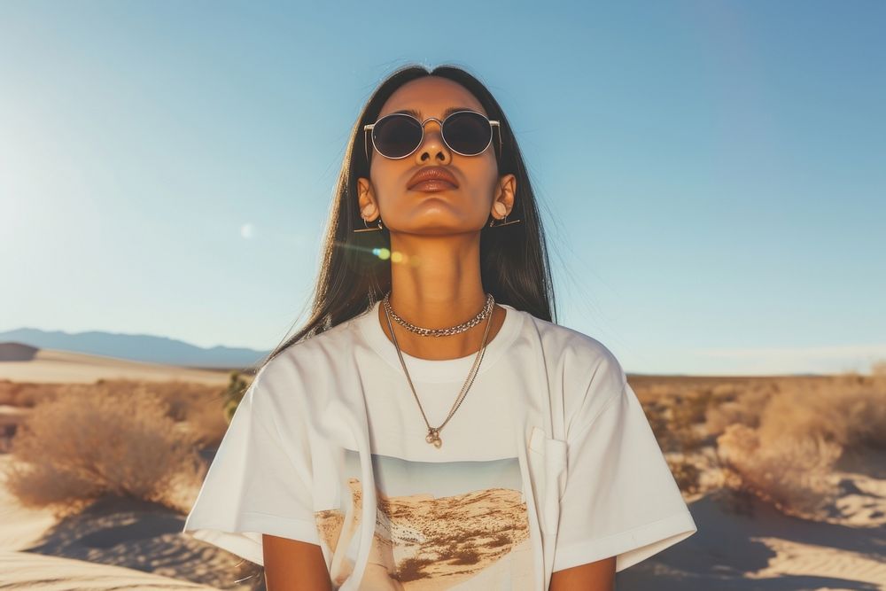 Indian american woman sunglasses desert contemplation.