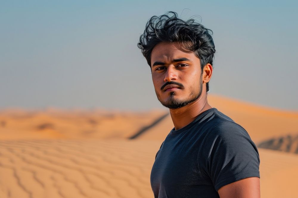 Indian man portrait outdoors desert.
