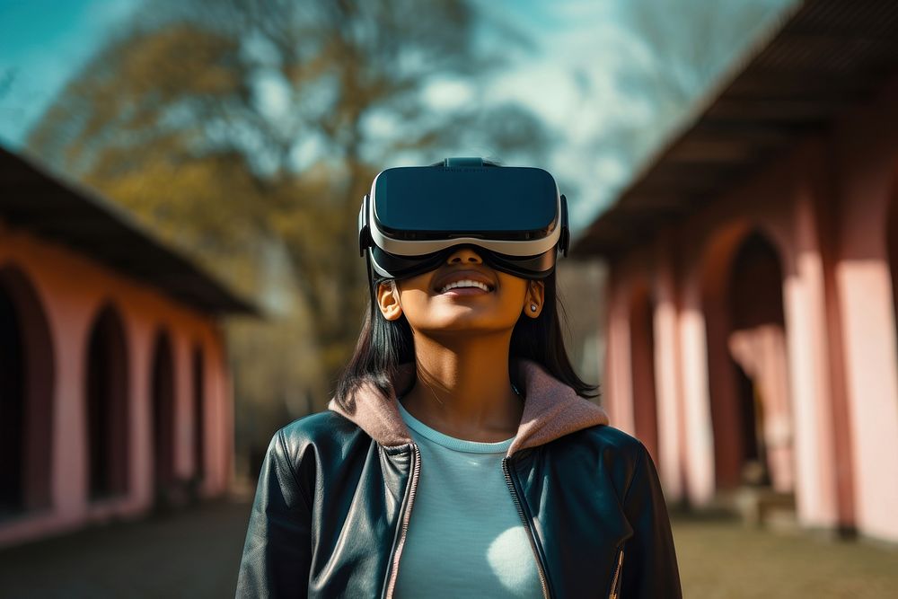 Indian teenager wearing vr glasses portrait photo architecture.