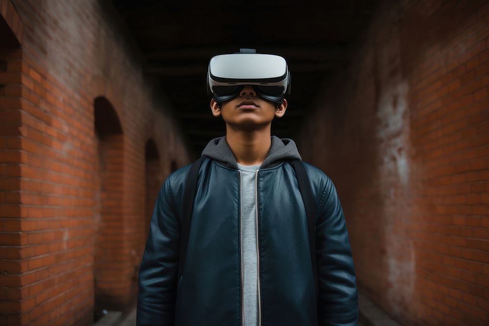 Indian teenager wearing vr glasses portrait photo city.
