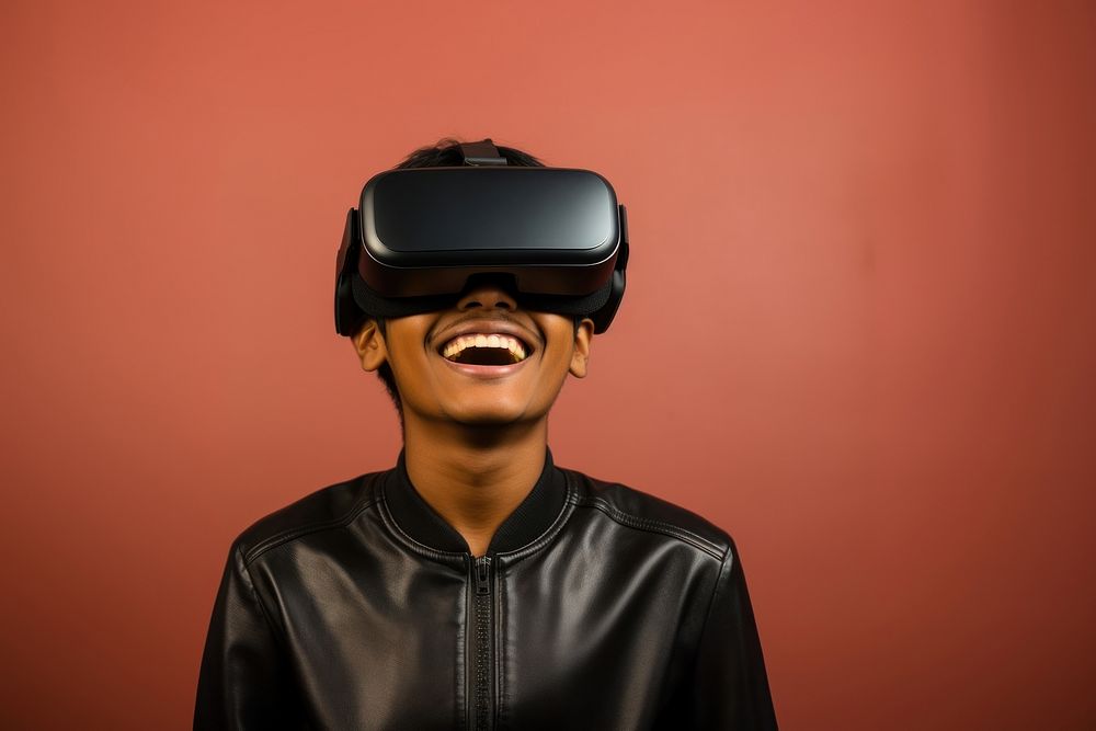 Indian teenager wearing vr glasses technology happiness portrait.