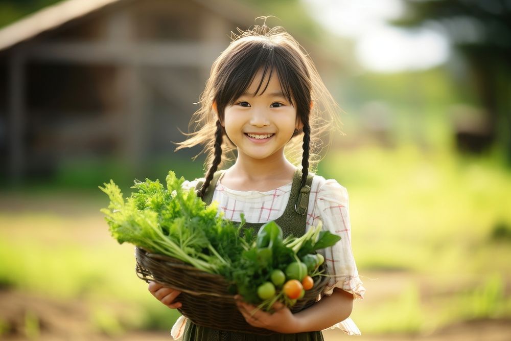 A happy japanese girl farmer holding vegetables smile outdoors organic.