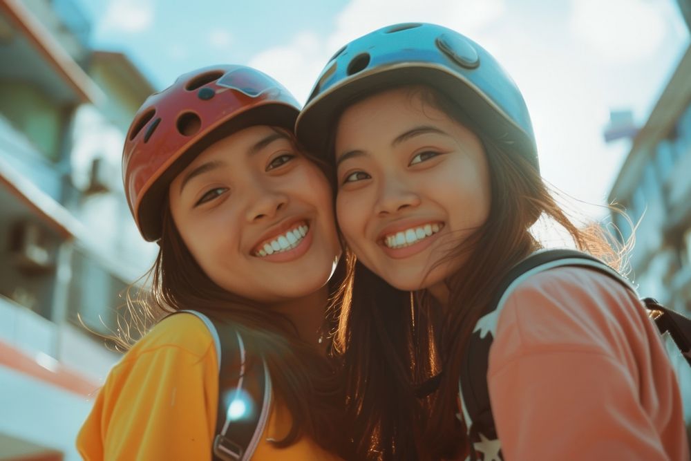 Young Filipino Women Roller Skaters in the City portrait photography helmet.