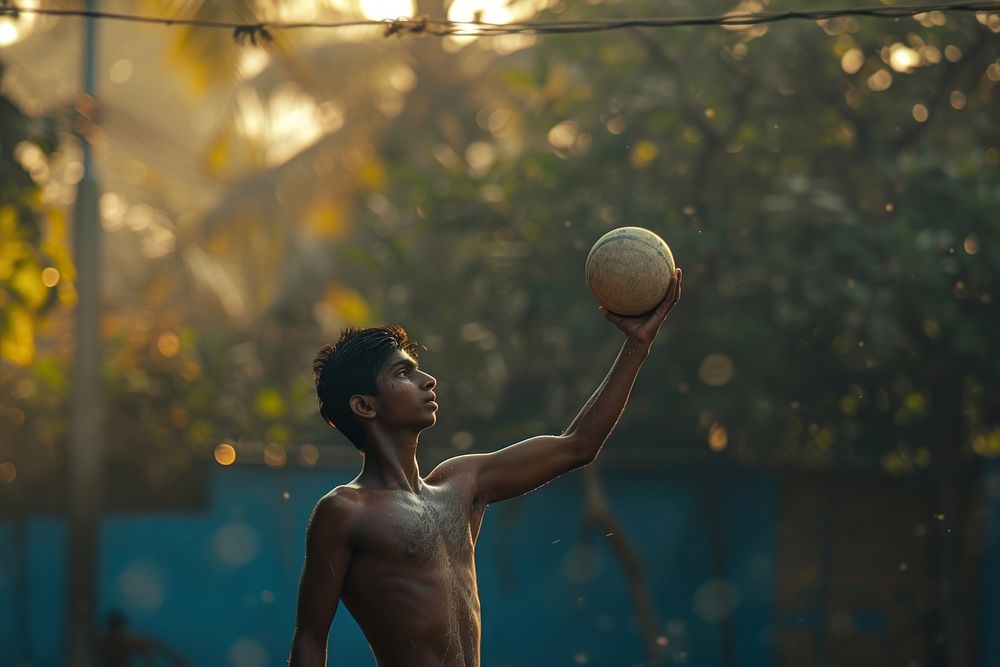 Indian young man playing sports and hobby throwing ball day.