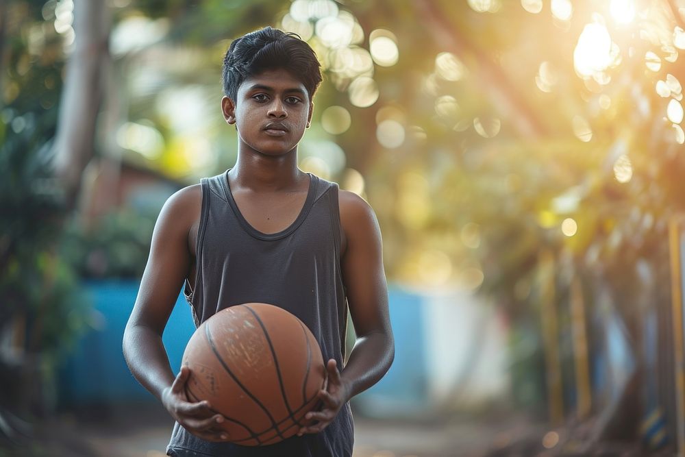 Sri Lankan young man playing sports and hobby basketball day exercising.