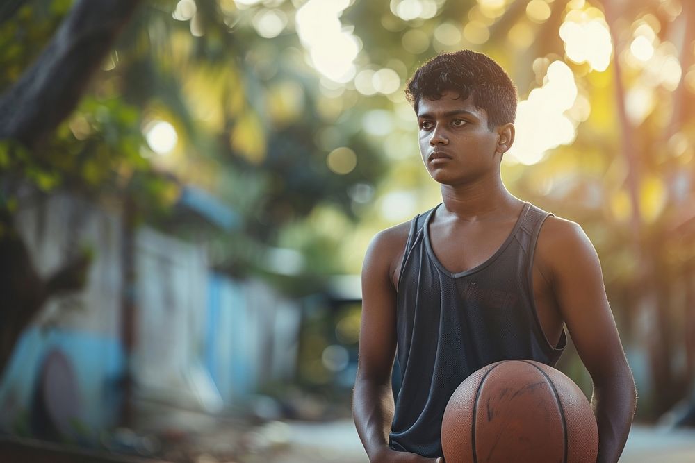 Sri Lankan young man playing sports and hobby basketball day contemplation.