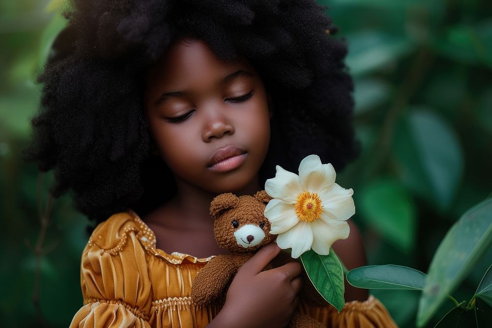 Girl with teddy bear flower child baby.