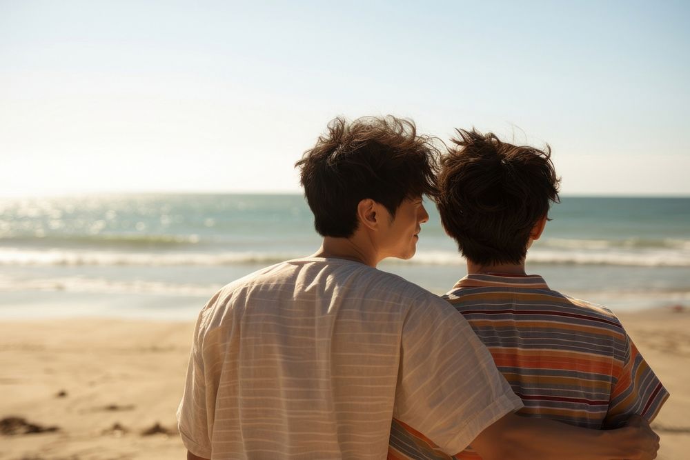 Korean gay couple happy portrait beach outdoors.