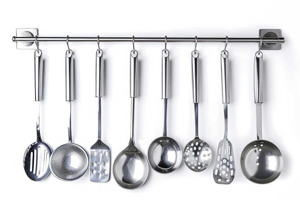 Kitchen utensils wall mounted chrome ladle spoon white background.