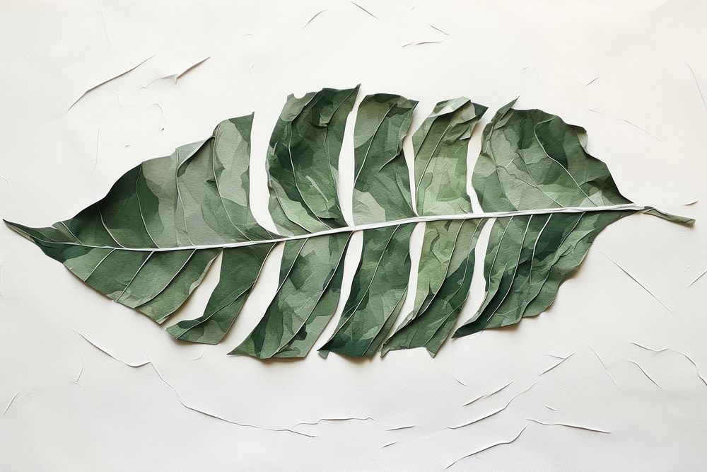 Abstract tropical leaf ripped paper plant art creativity.