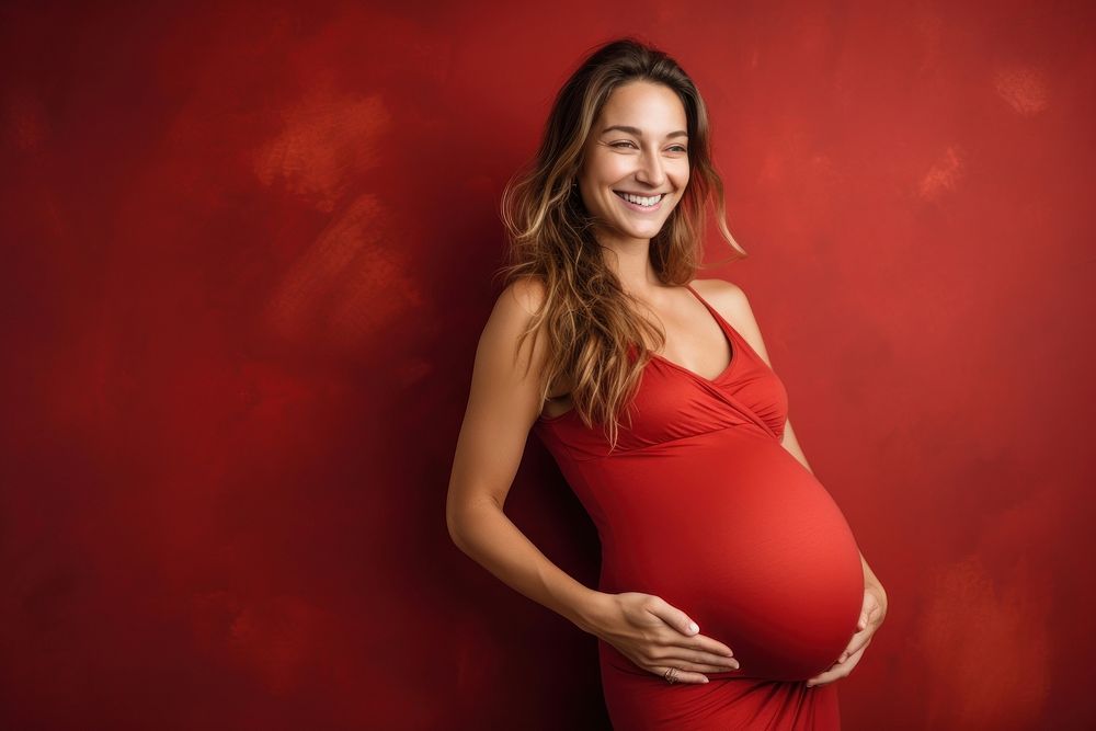 Woman fitness during pregnancy laughing portrait smiling.