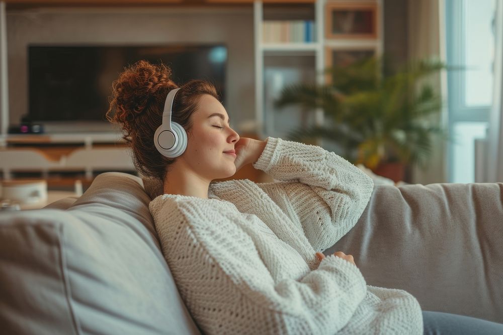 Woman listen a music headphones adult cozy.