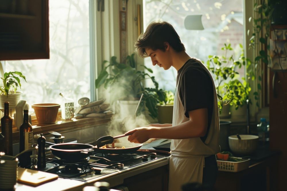 A man cooking kitchen home food.