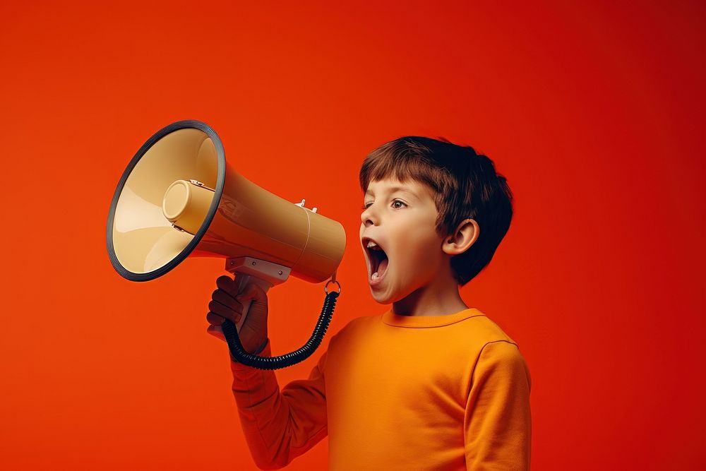 Boy with loudspeaker shouting child performance.