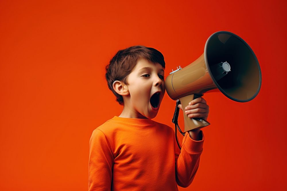 Boy with loudspeaker shouting performance appliance.