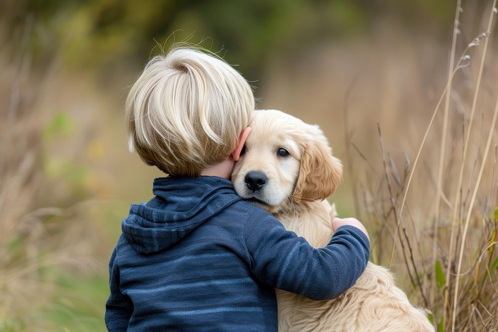 A boy cuddling a dog photography portrait animal.
