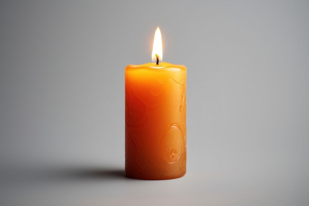Candle illuminated darkness cylinder.