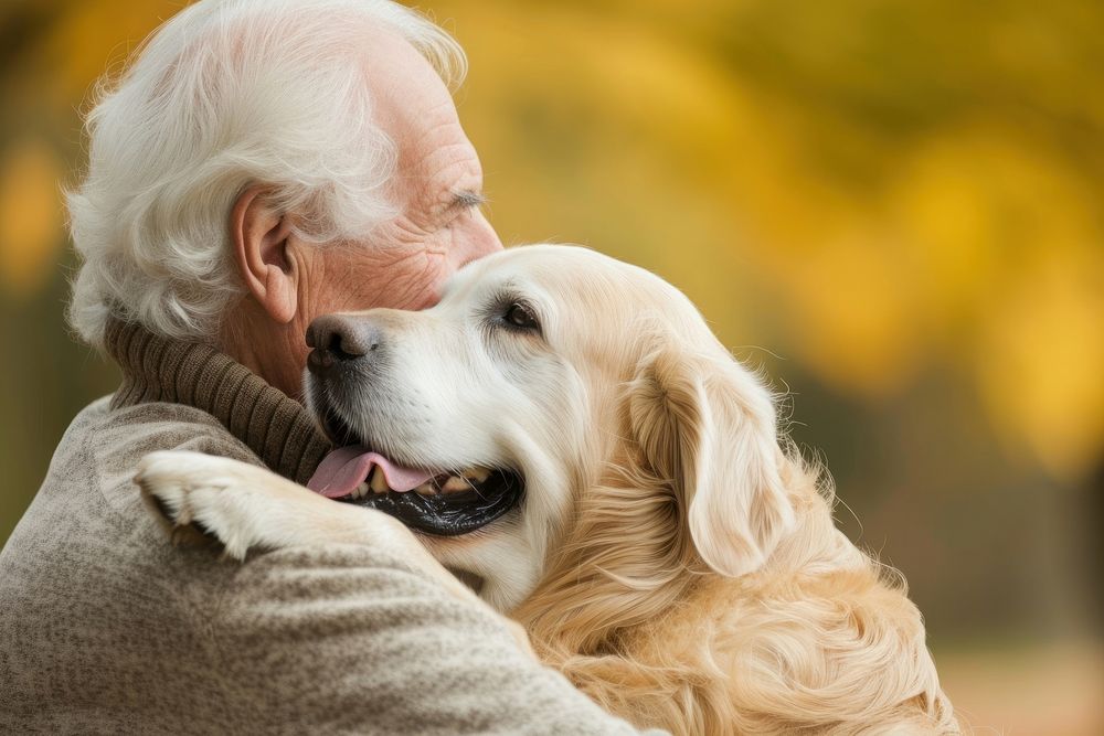 A elderly guy cuddling a dog photography animal mammal.