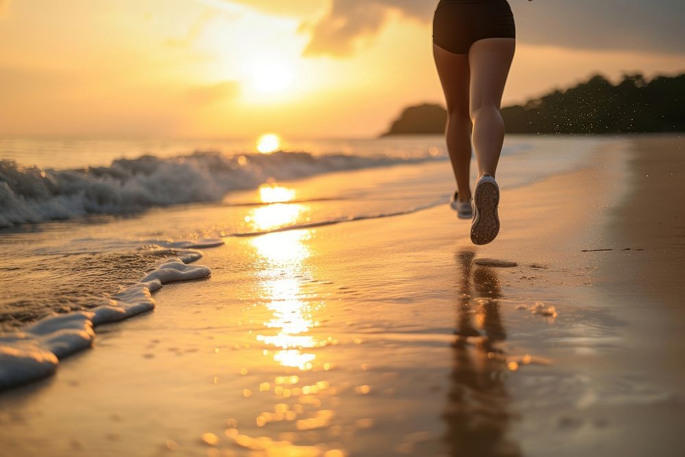 Healthy woman running walking beach.