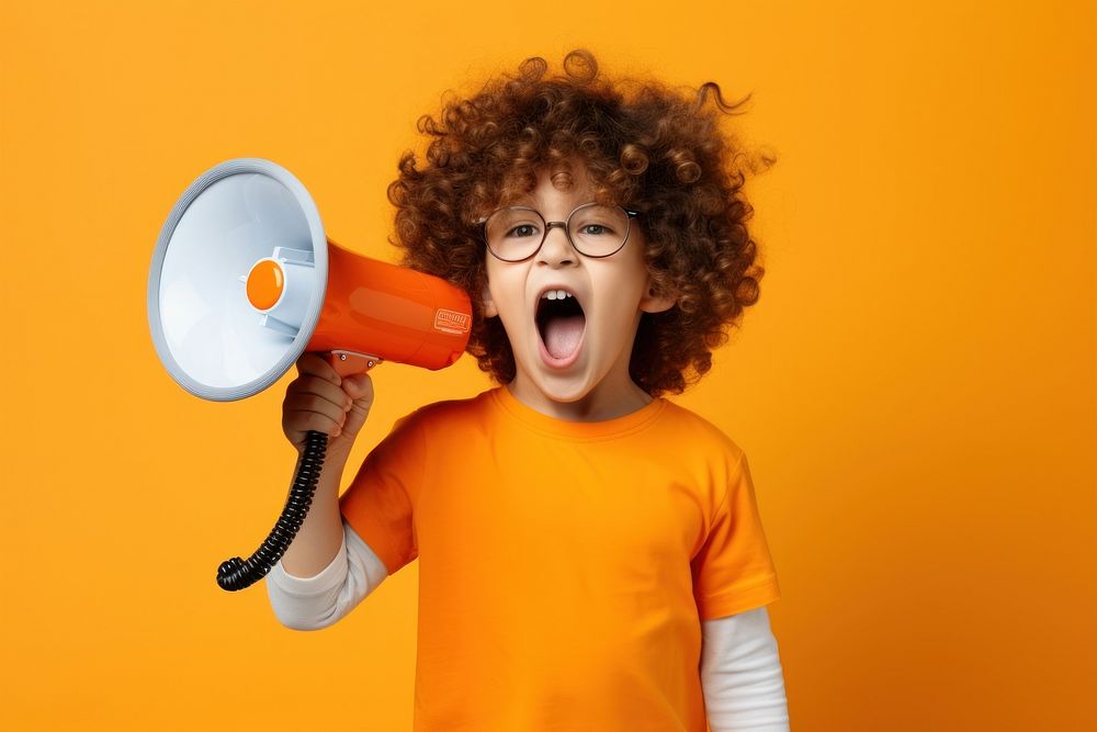 Boy with loudspeaker shouting accessories technology.