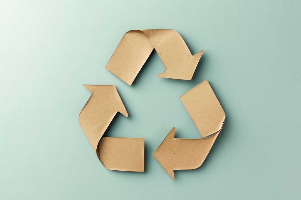 Brown paper cut out shape of the recycling symbol container cardboard letterbox.