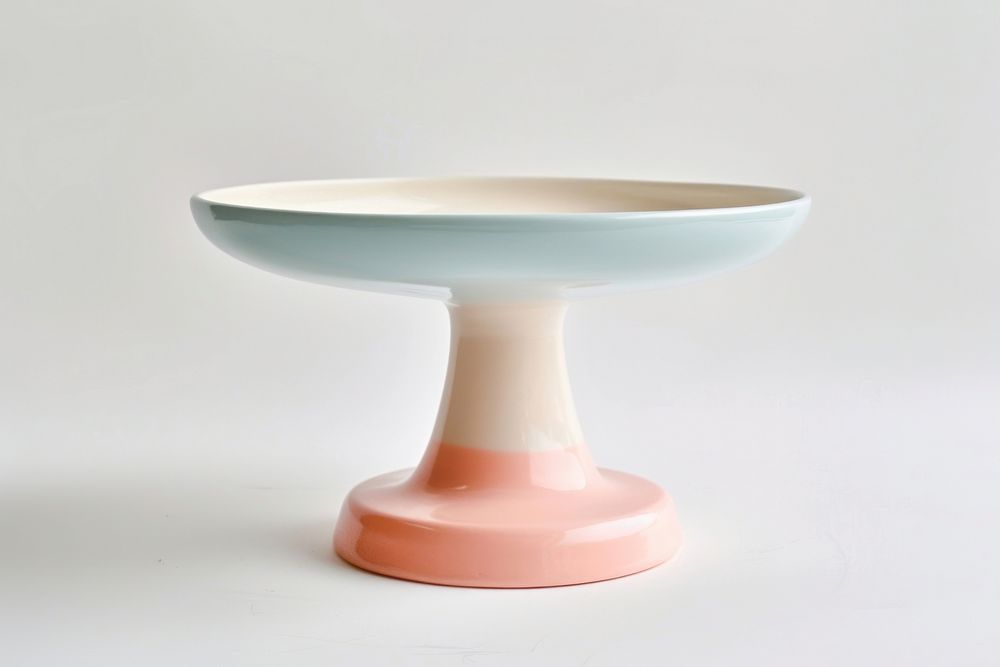 One piece of pastel ceramic pedestal cake plate porcelain tableware furniture.