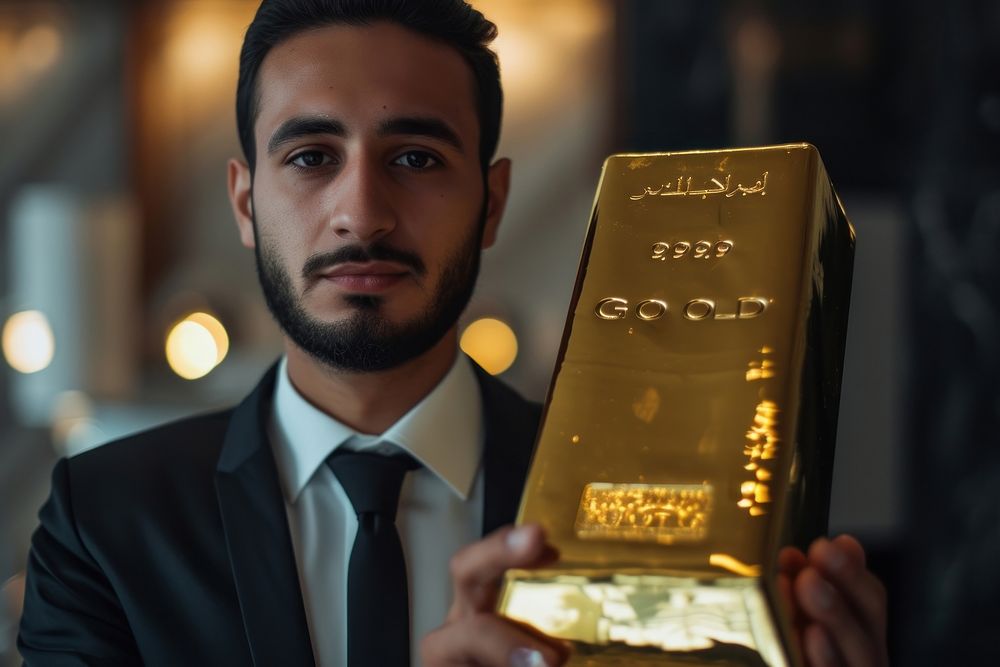 Gold holding adult man.