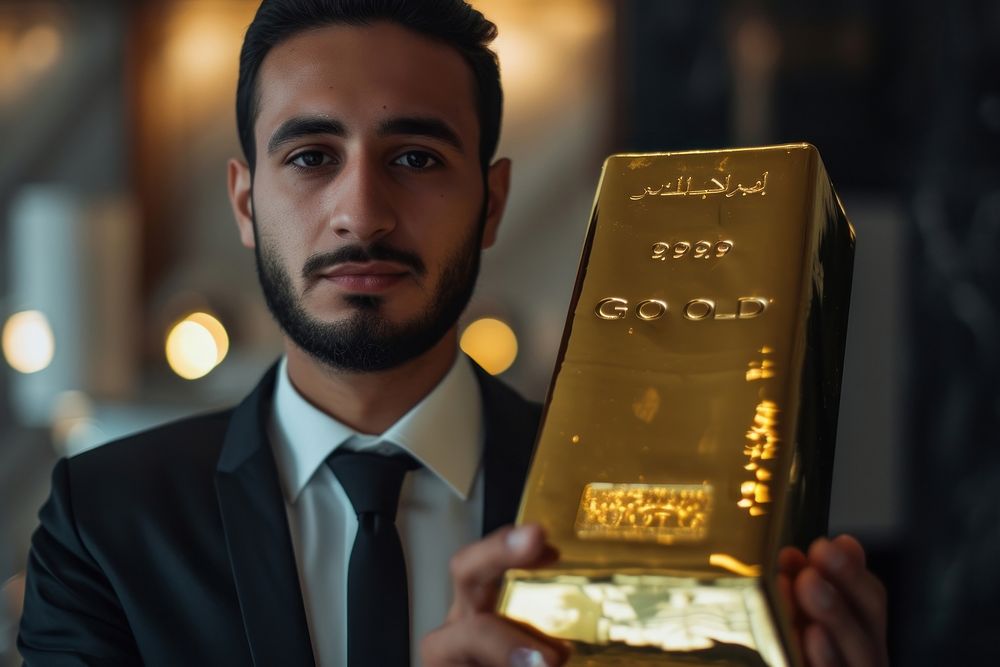 Gold holding adult man. | Premium Photo - rawpixel