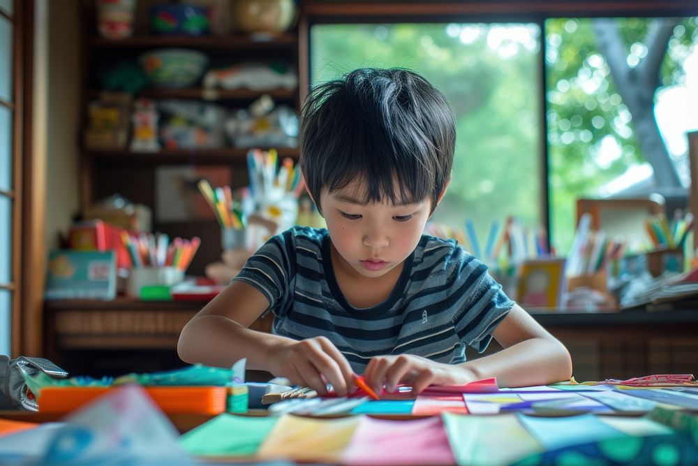 Japanese boy using stationary child concentration creativity.