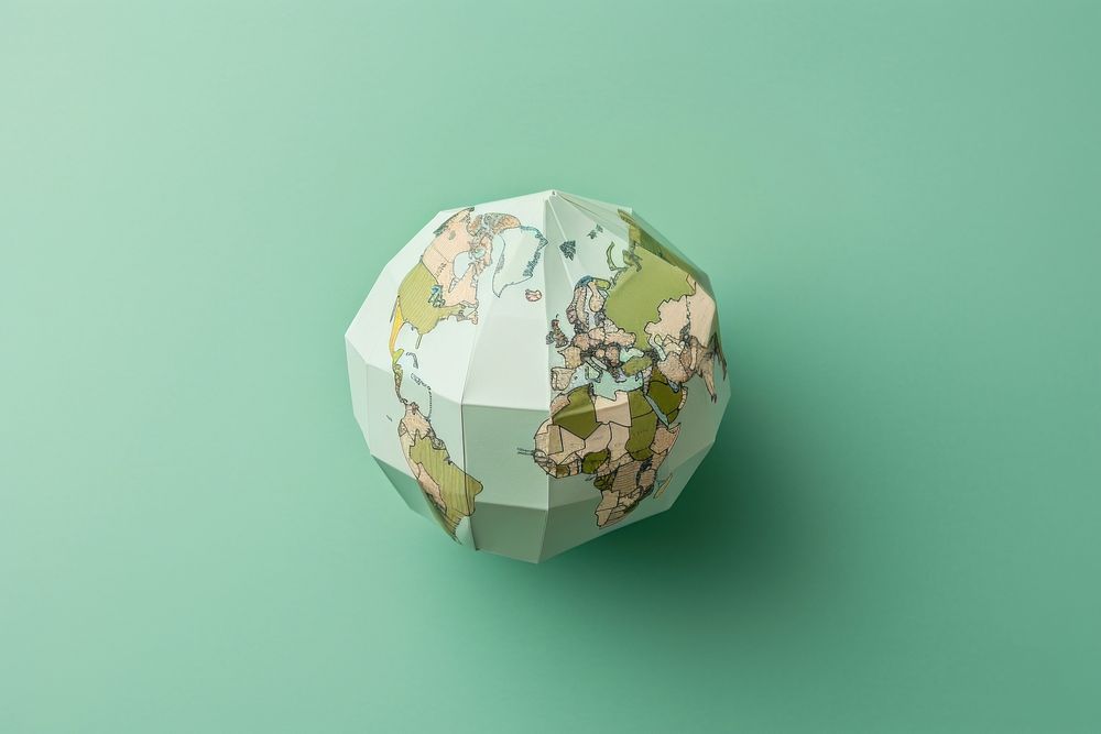 2 hands holding a paper craft Globe sphere globe green.