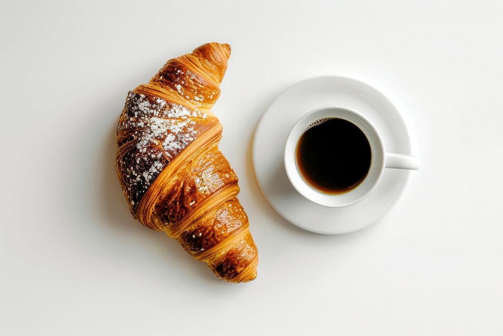 Bread breakfast croissant coffee drink.