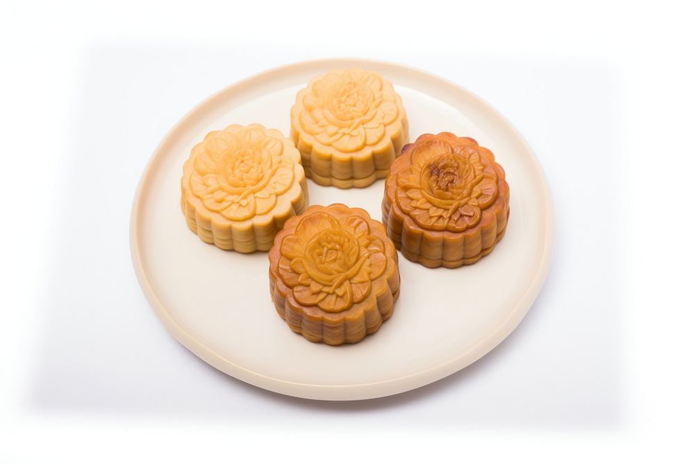 A chinese mooncake cut open arranged put on plate dessert pastry food.
