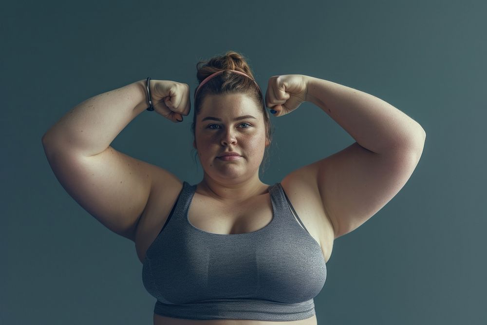 Fat white woman flexing muscle portrait sports adult.