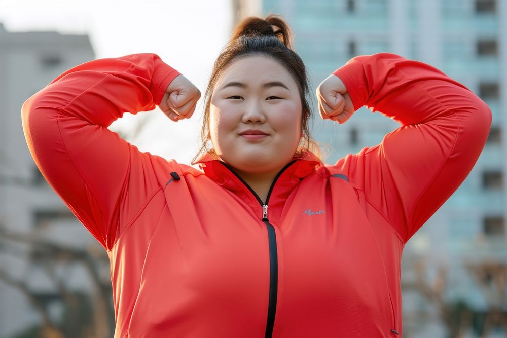 Fat asian woman flexing muscle sports adult flexing muscles.