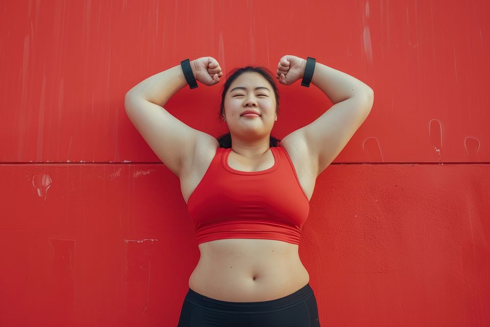 Fat asian woman flexing muscle pose sports adult flexing muscles.