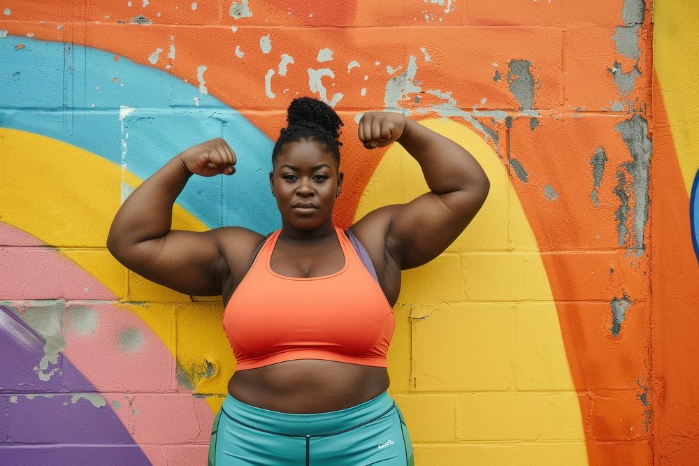 Fat black woman flexing muscle pose sports adult flexing muscles.