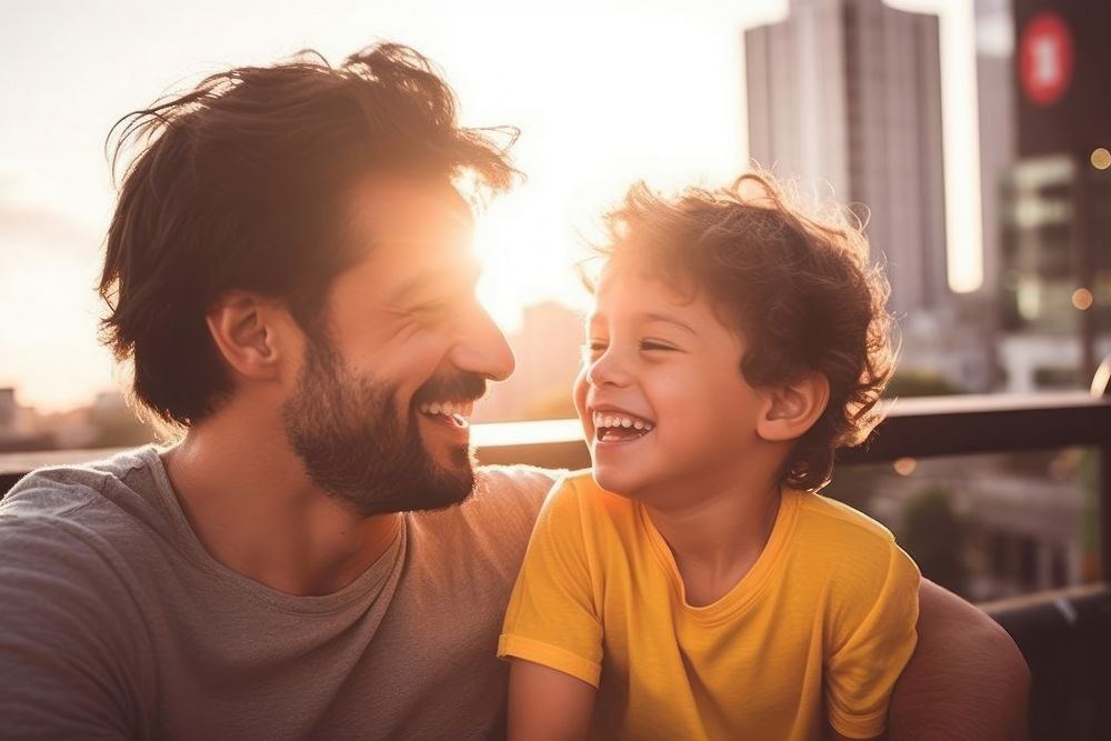 Brazilian dad spend time with son laughing portrait family.