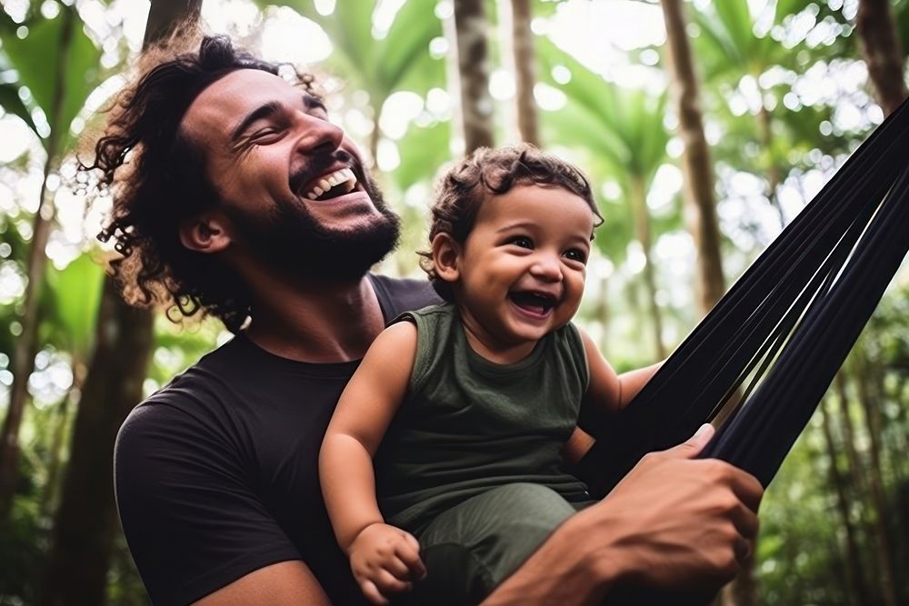 Brazilian dad spend time with son laughing portrait family.