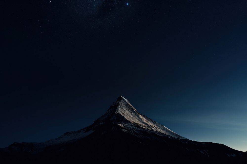 Mountain peak at night landscape astronomy outdoors.