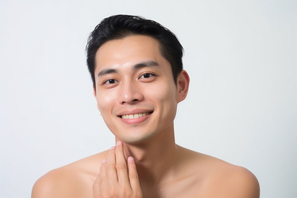 Man cleaning his face portrait smile adult.