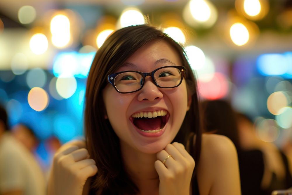 Woman Singaporean Joyful laughing portrait glasses.