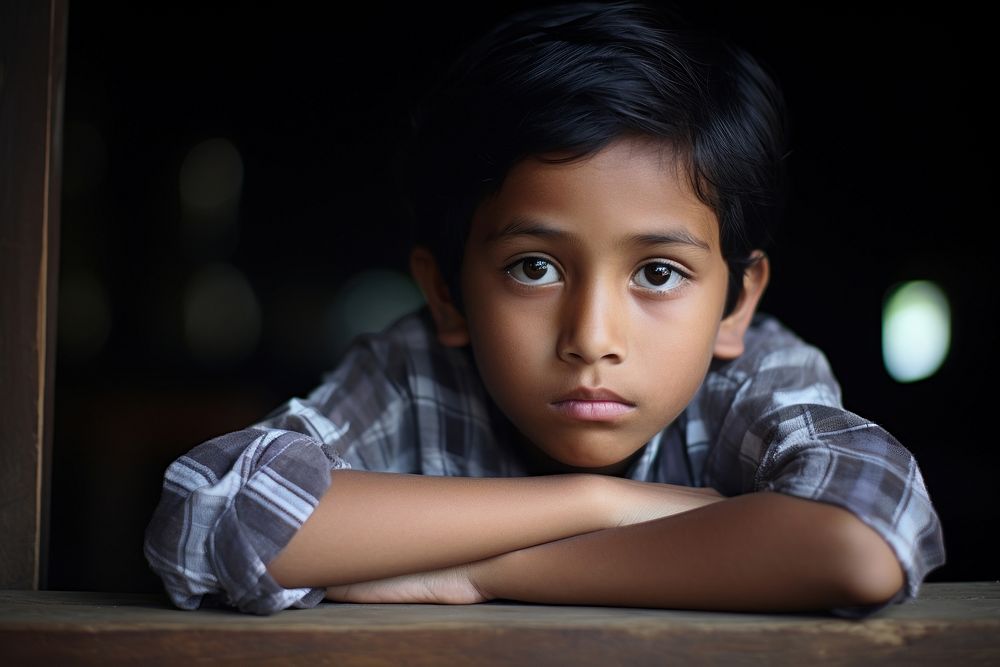 Boy Indonesian Contemplative Curiosity portrait worried child.