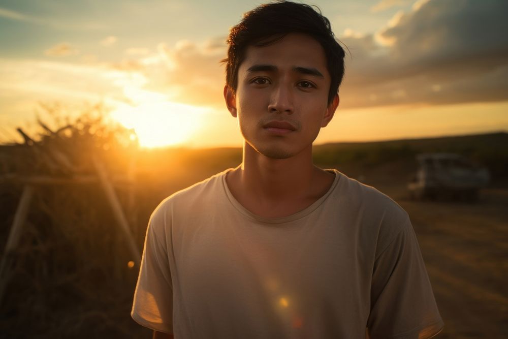 Man Filipino Hopeful sunlight portrait outdoors.