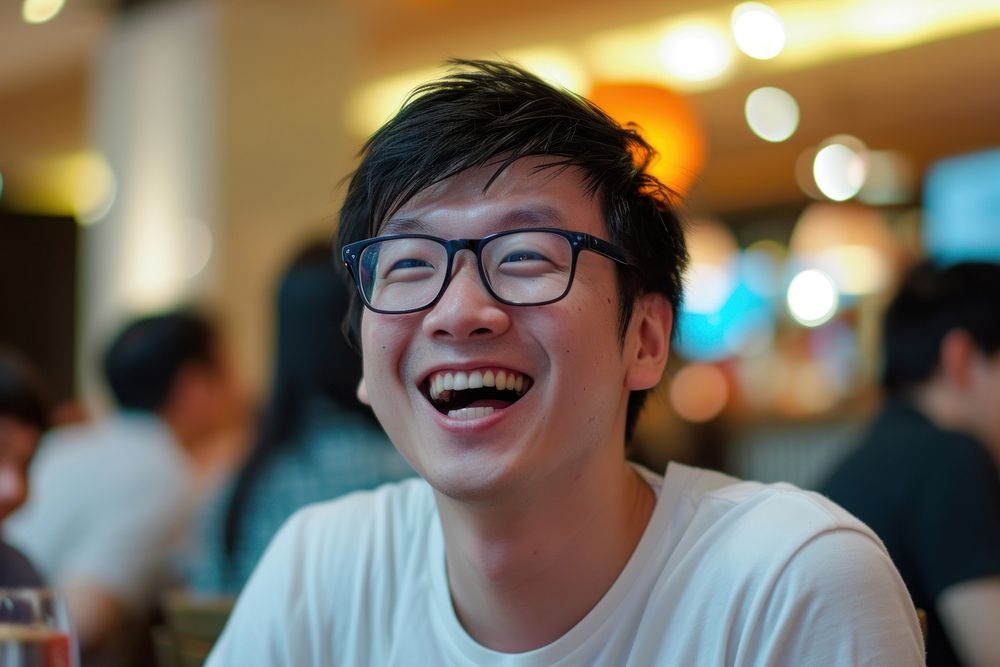Man Singaporean Joyful laughing portrait glasses.