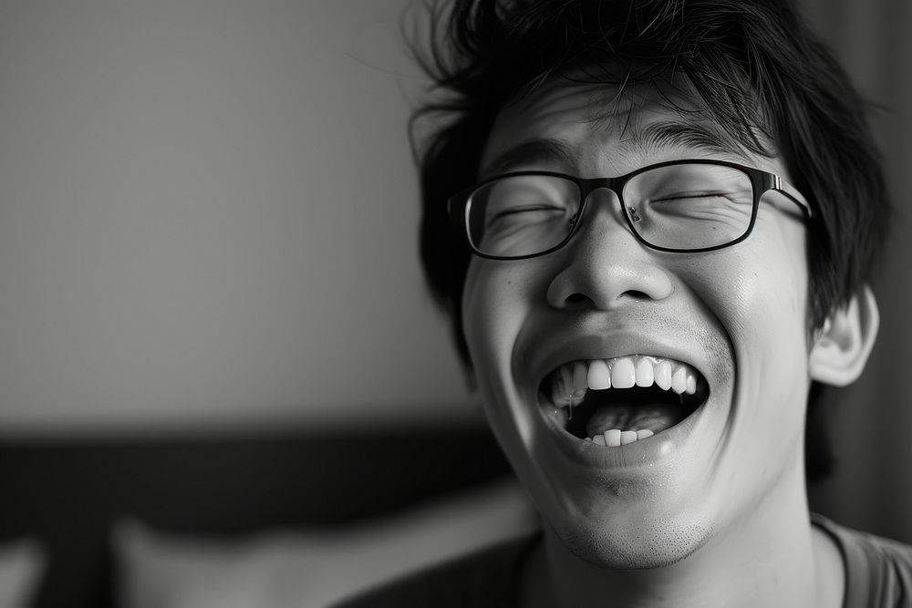 Man Singaporean Joyful laughing portrait glasses.