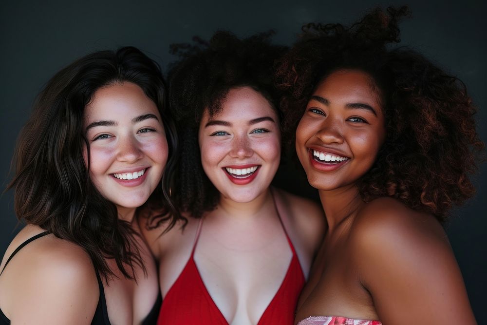 Women body types with different ethnicities smile laughing portrait.